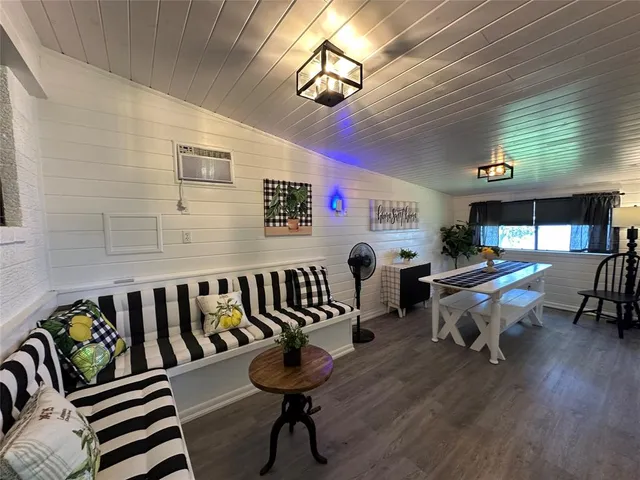 a reading room with furniture and wooden floor