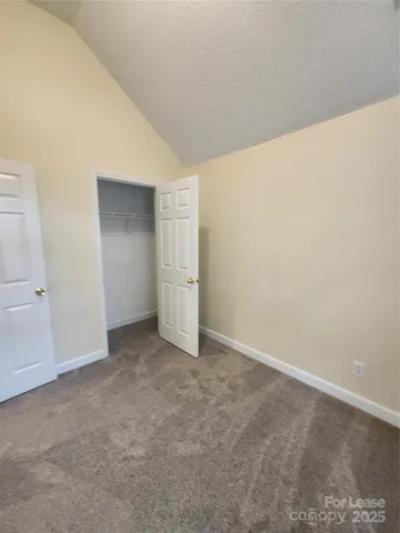 an empty room with a empty space and windows