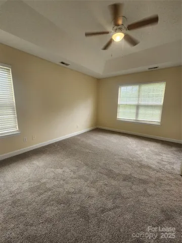 a view of an empty room and a bathroom