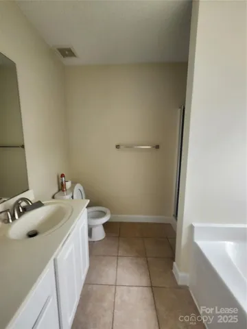 a bathroom with a bathtub and a window