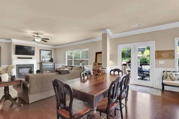 a view of a dining room with furniture window and outside view