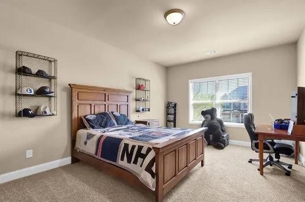 a bed room with a bed and a window