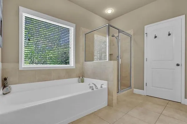 a bathroom with a bathtub and a shower
