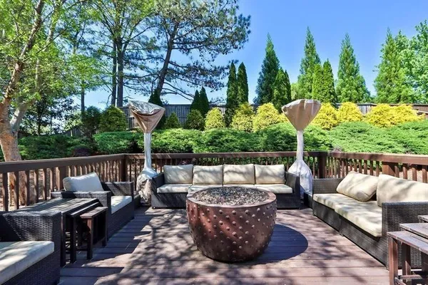 a view of a patio with couches chairs and a fire pit