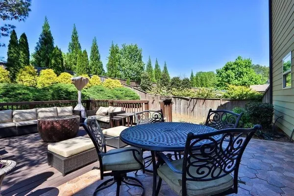 a view of a chairs and table in patio