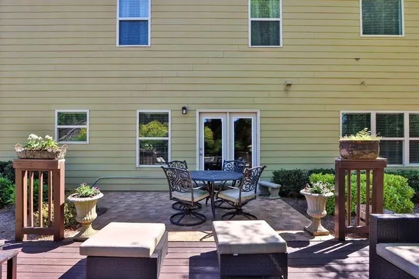 a backyard of a house with outdoor seating