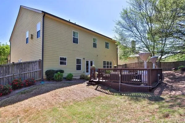 a view of back yard with patio