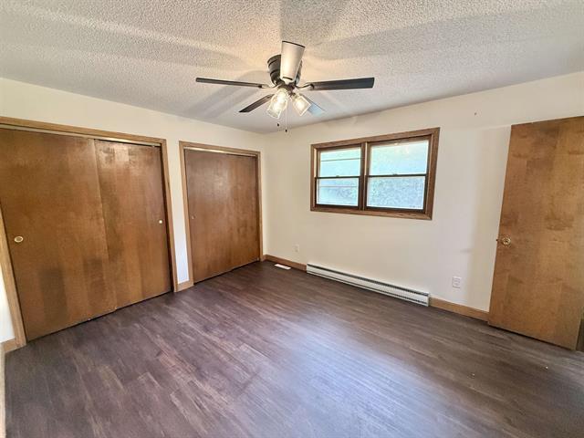 8567 Valley View Drive Stillman Valley, IL 61084 - Photo 14 of 29 a view of an empty room with wooden floor and a window