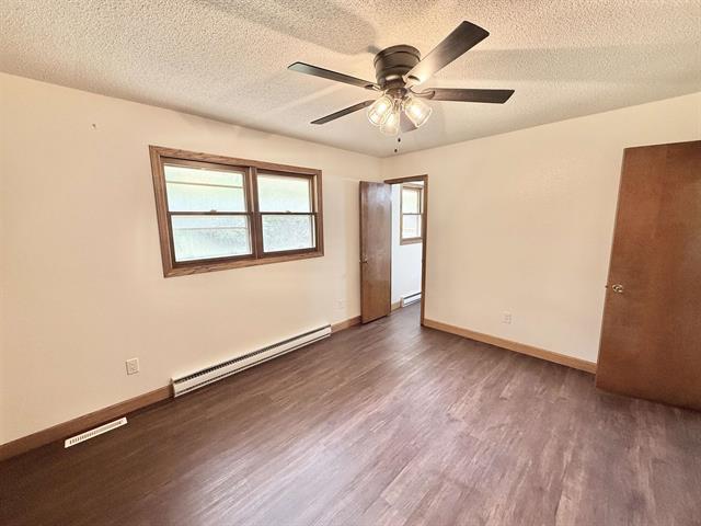 8567 Valley View Drive Stillman Valley, IL 61084 - Photo 15 of 29 a view of an empty room with wooden floor and a window