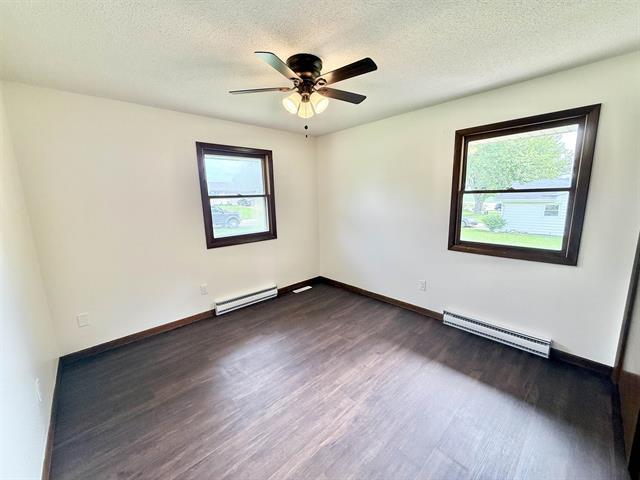 8567 Valley View Drive Stillman Valley, IL 61084 - Photo 18 of 29 a view of an empty room with wooden floor and a window