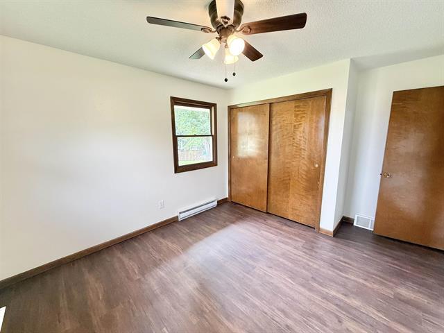 8567 Valley View Drive Stillman Valley, IL 61084 - Photo 19 of 29 an empty room with wooden floor and windows