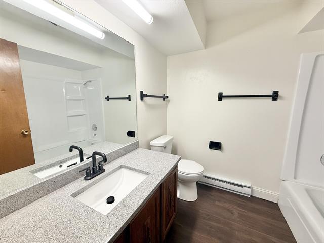 8567 Valley View Drive Stillman Valley, IL 61084 - Photo 24 of 29 a bathroom with a sink toilet and shower