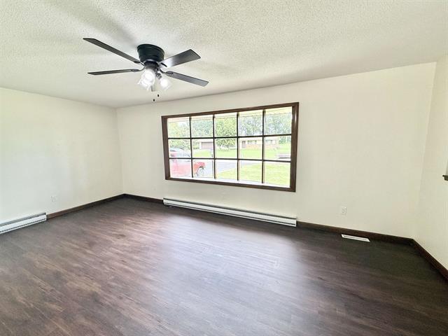 8567 Valley View Drive Stillman Valley, IL 61084 - Photo 6 of 29 an empty room with wooden floor and windows