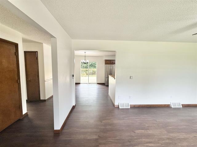 8567 Valley View Drive Stillman Valley, IL 61084 - Photo 7 of 29 a view of a hallway with wooden floor