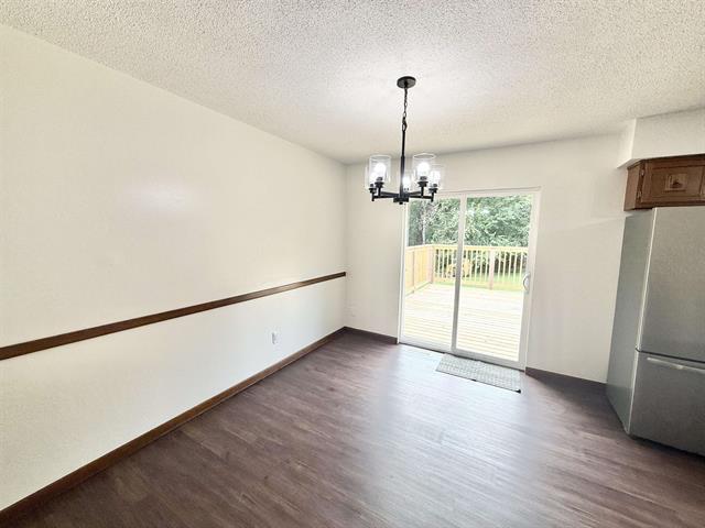 8567 Valley View Drive Stillman Valley, IL 61084 - Photo 8 of 29 a view of empty room with wooden floor and fan