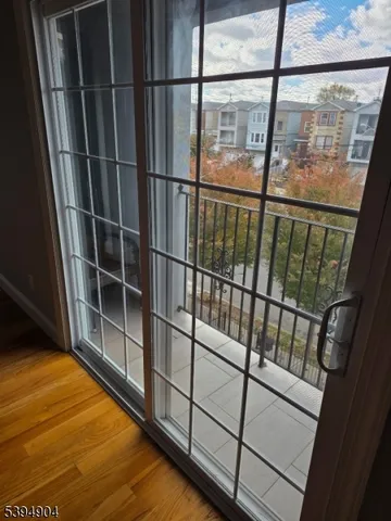 a view of outdoor space with wooden floor