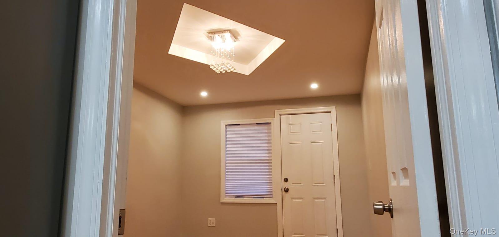 914 Duncan Street Bronx, NY 10469 - Photo 2 of 10 a view of a hallway with windows