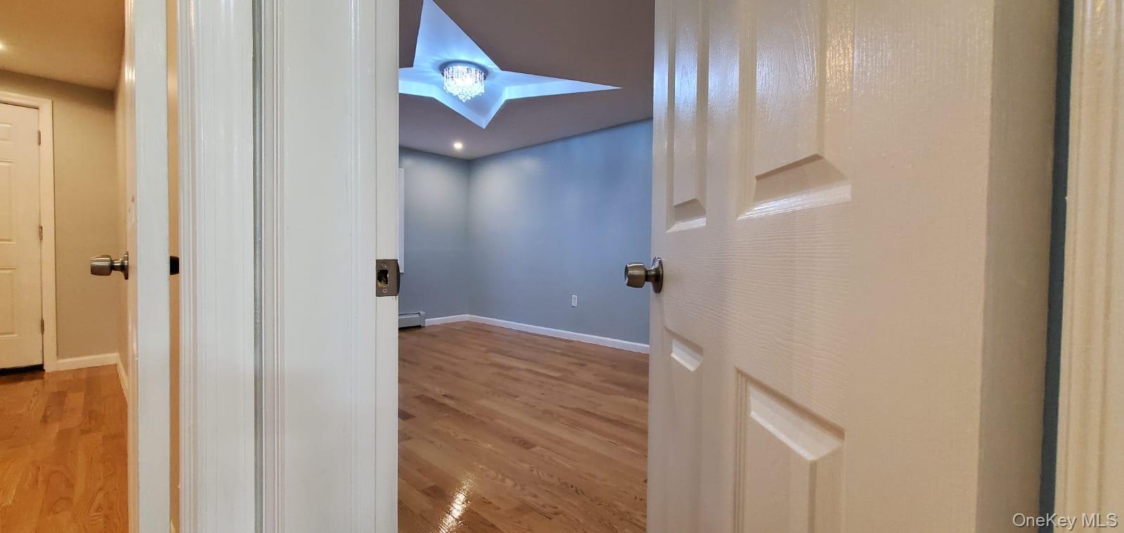 914 Duncan Street Bronx, NY 10469 - Photo 5 of 10 a bathroom with a bathtub and shower