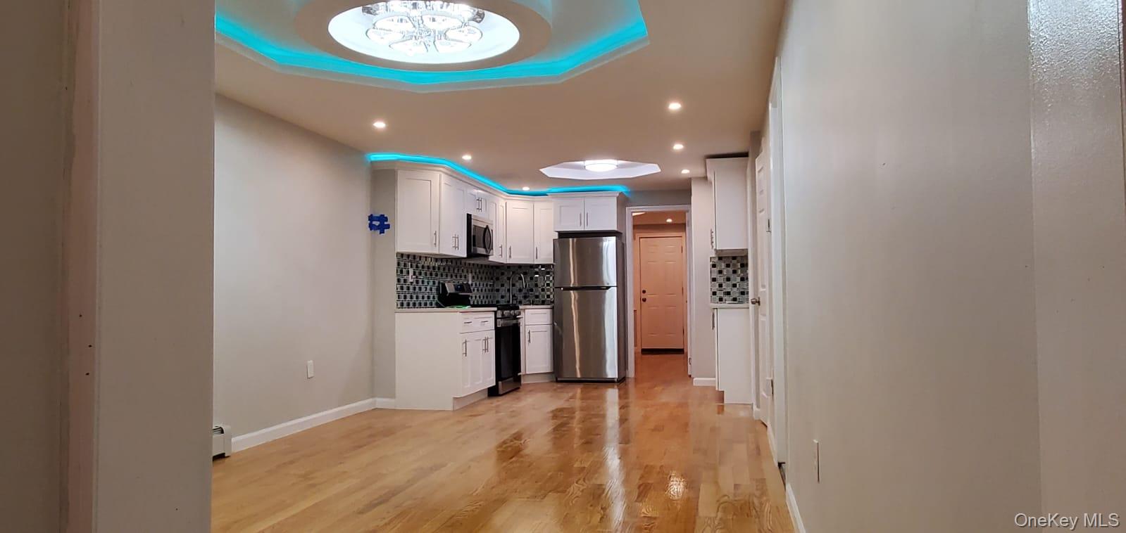 914 Duncan Street Bronx, NY 10469 - Photo 8 of 10 a bathroom with a sink and a mirror