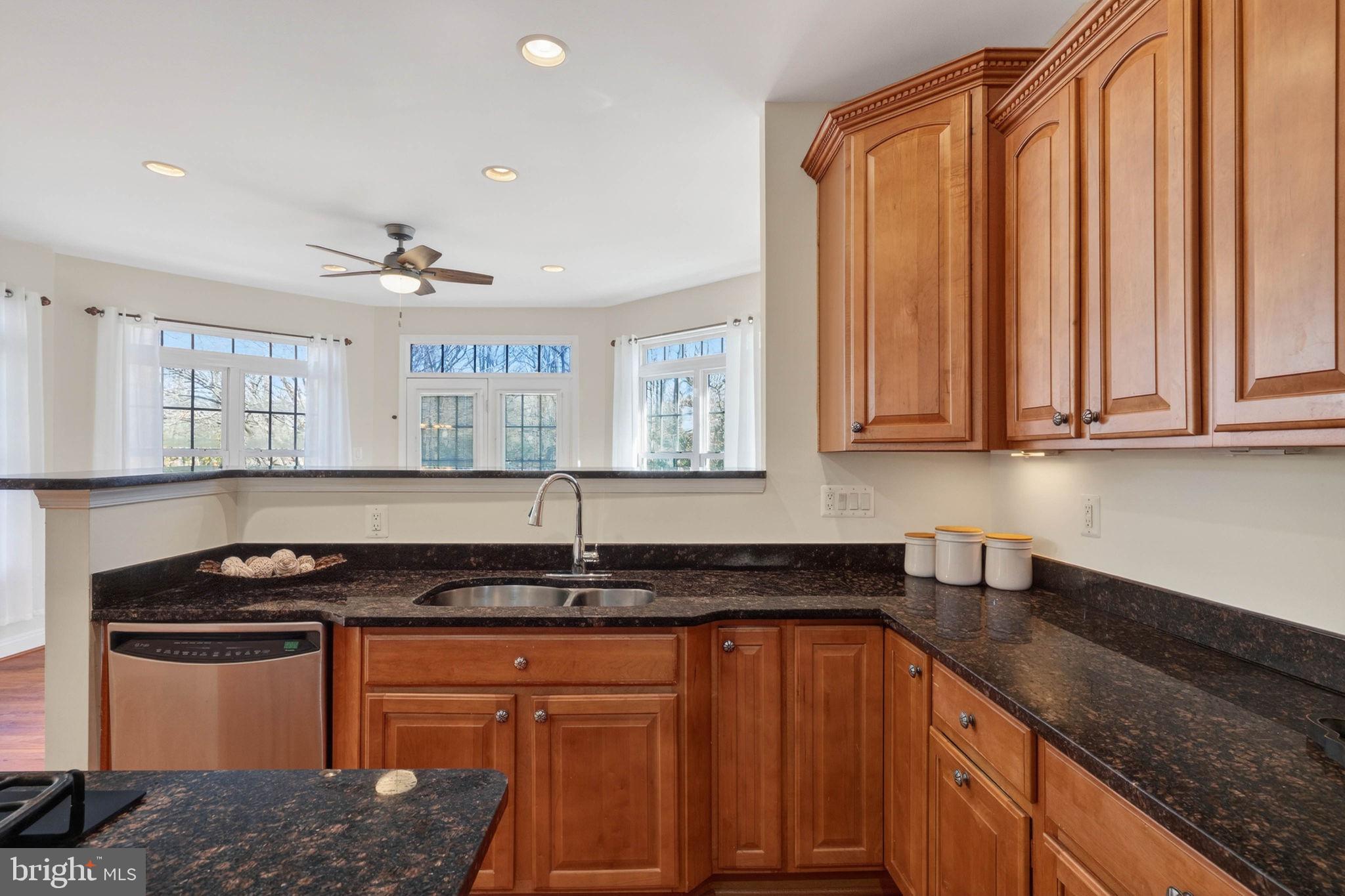 3313 Lady Catherine Circle Triangle, VA 22172 - Photo 13 of 51 a kitchen with stainless steel appliances granite countertop a sink stove and cabinets