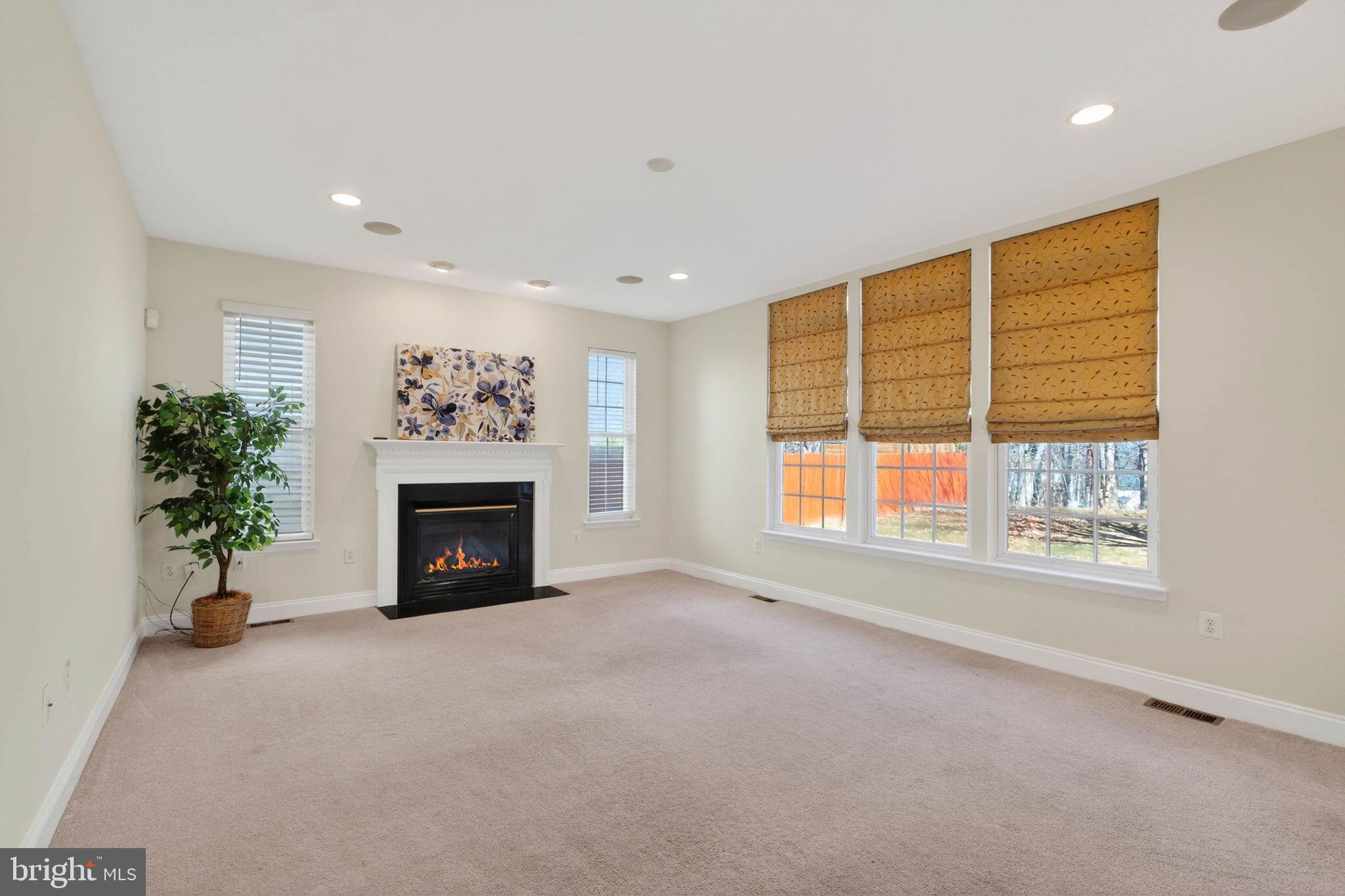 3313 Lady Catherine Circle Triangle, VA 22172 - Photo 18 of 51 a view of an empty room with a fireplace and a window