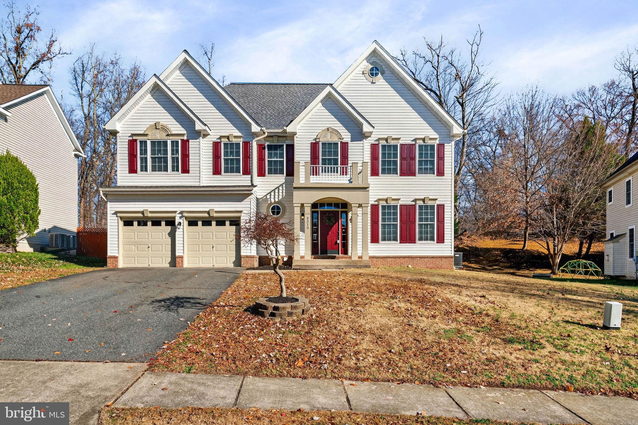 3313 Lady Catherine Circle Triangle, VA 22172 - Photo 2 of 51 a front view of a house with a yard