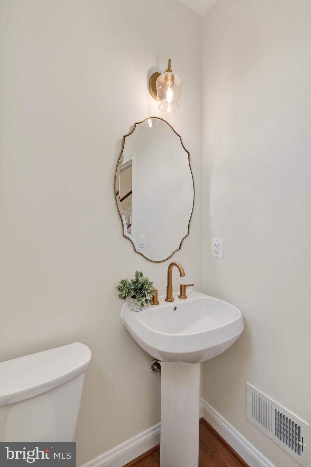 3313 Lady Catherine Circle Triangle, VA 22172 - Photo 26 of 51 a bathroom with a sink a mirror and toilet