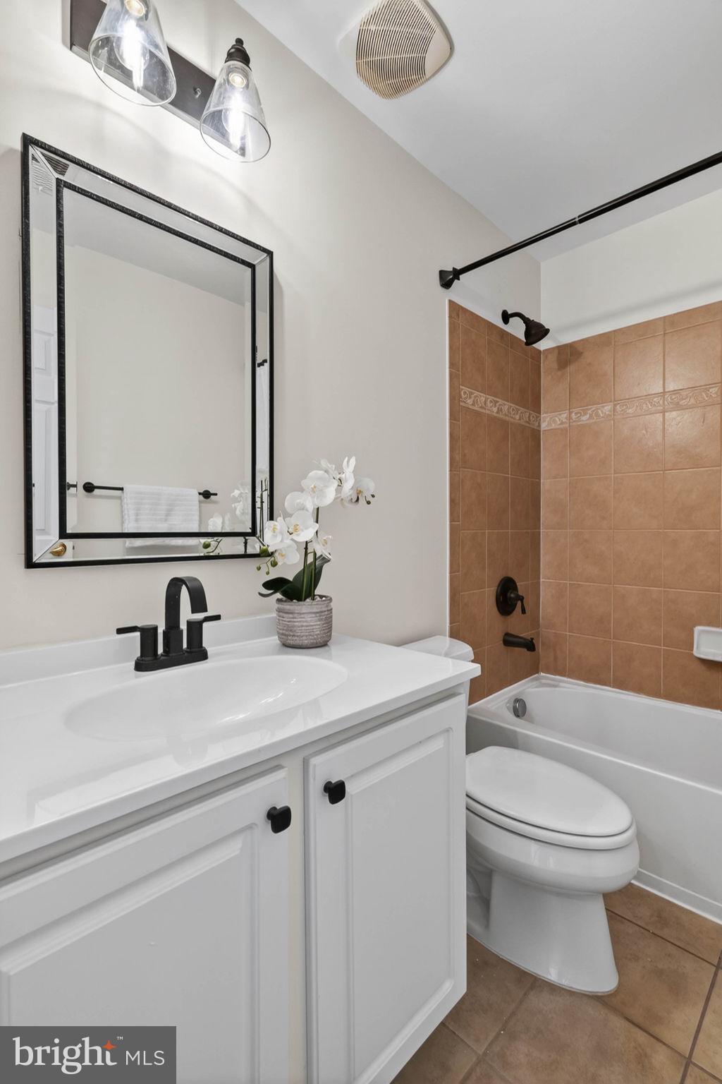 3313 Lady Catherine Circle Triangle, VA 22172 - Photo 41 of 51 a bathroom with a sink a toilet and a mirror