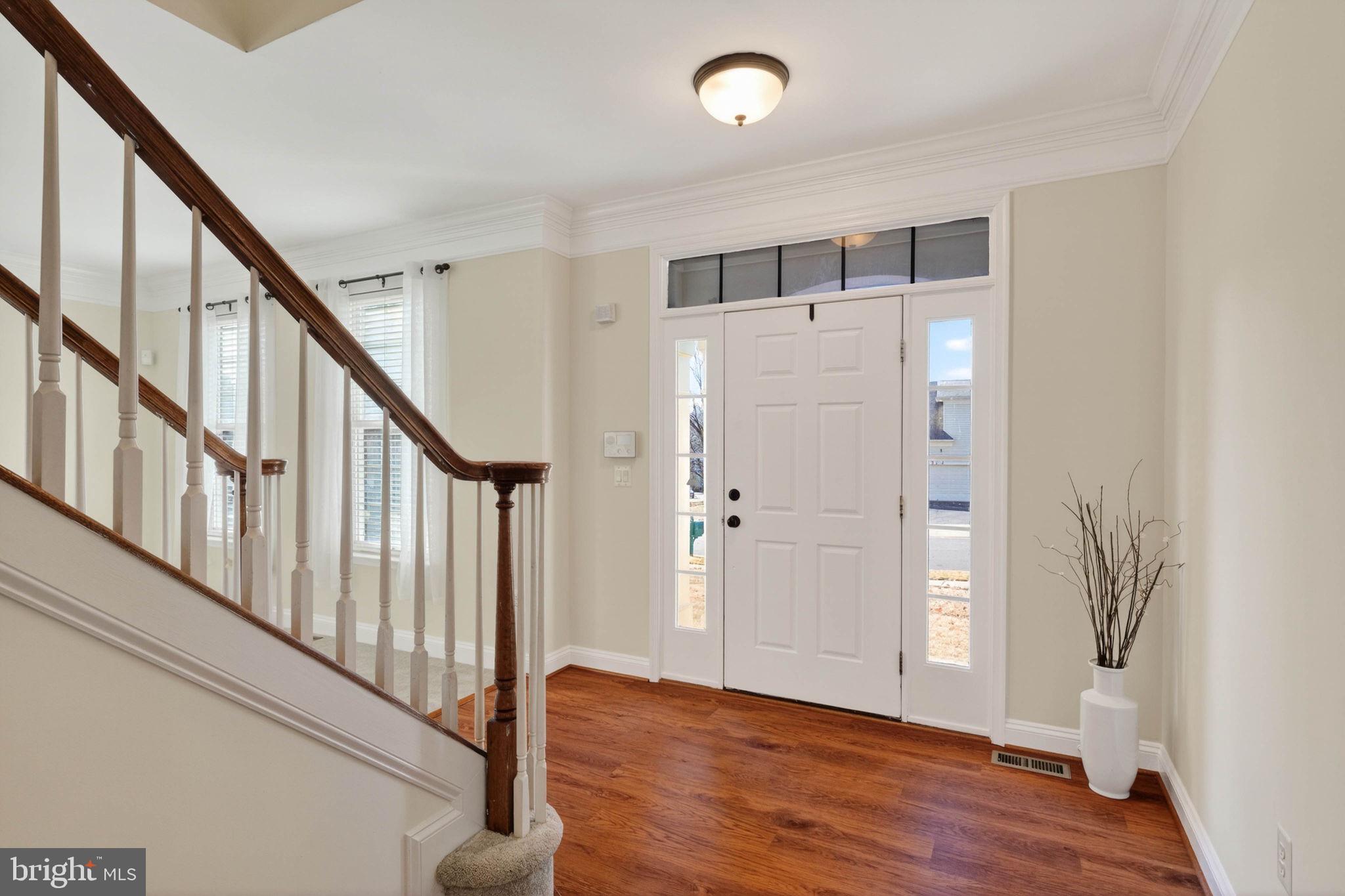 3313 Lady Catherine Circle Triangle, VA 22172 - Photo 6 of 51 a view of an entryway with wooden floor and stairs