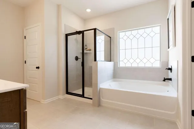 a white bath tub sitting next to a window