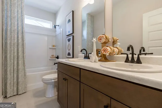 a bedroom with a bed and a chair