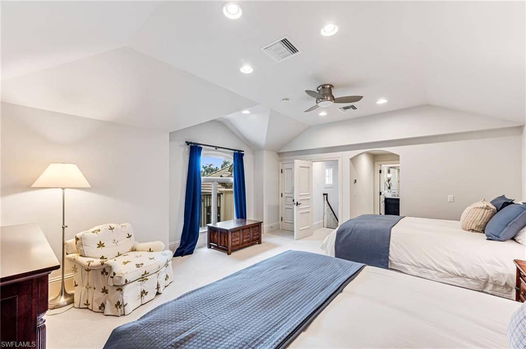 2560 Half Moon Walk Naples, FL 34102 - Photo 29 of 44 Carpeted bedroom with ceiling fan and lofted ceiling