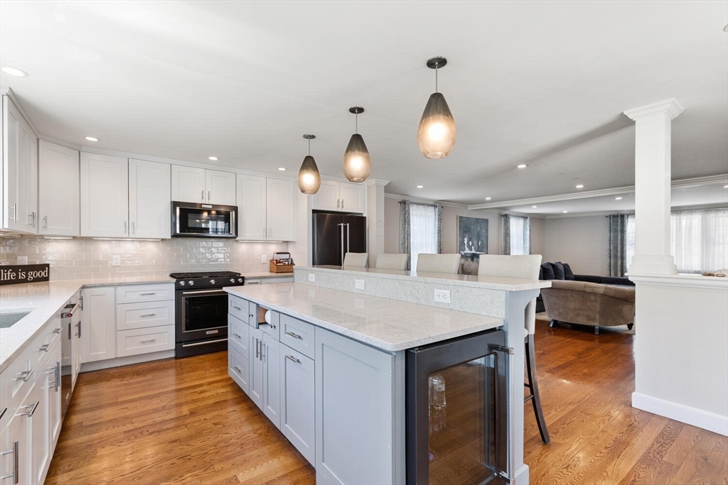 149 Robbins Road Watertown, MA 02472 - Photo 13 of 33 a large kitchen with kitchen island a sink table and chairs