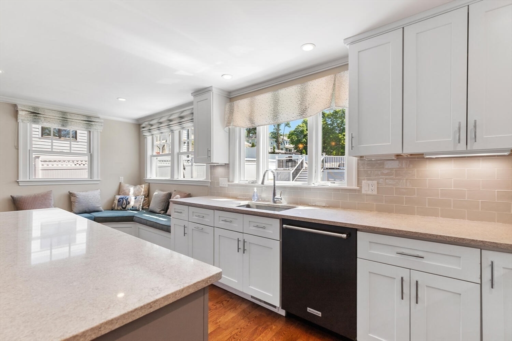 149 Robbins Road Watertown, MA 02472 - Photo 14 of 33 a kitchen with a sink stove and cabinets