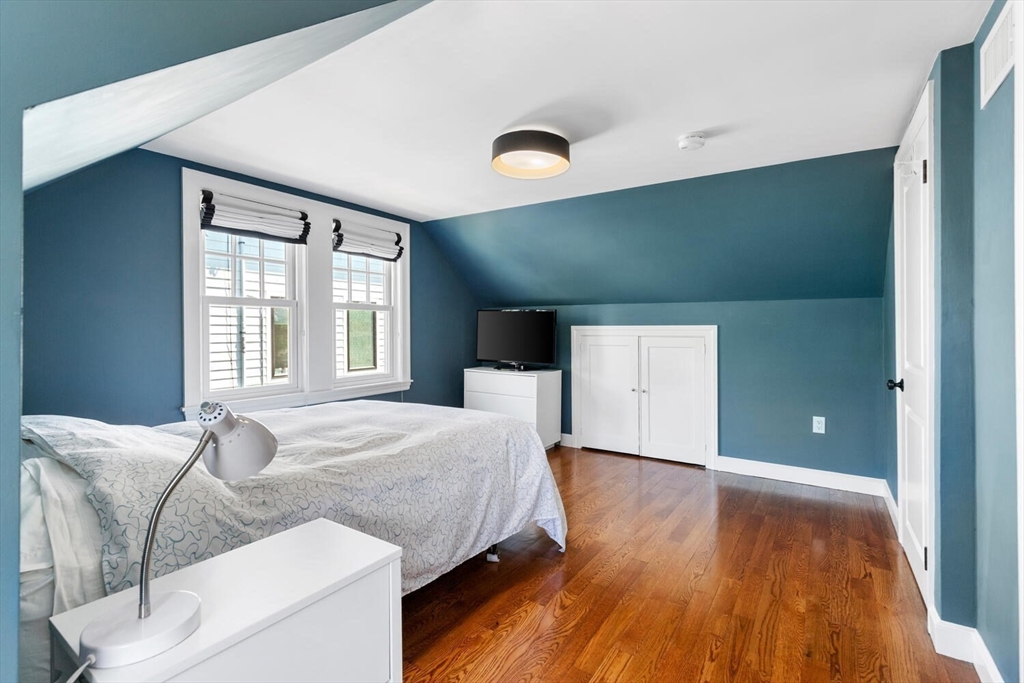 149 Robbins Road Watertown, MA 02472 - Photo 19 of 33 a bedroom with a bed and a large window