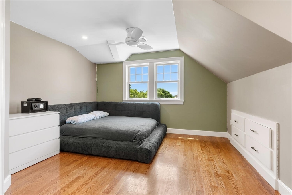 149 Robbins Road Watertown, MA 02472 - Photo 22 of 33 a bedroom with a bed and a dresser