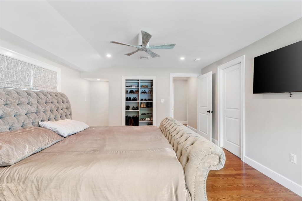 149 Robbins Road Watertown, MA 02472 - Photo 26 of 33 a spacious bedroom with a bed and a flat screen tv