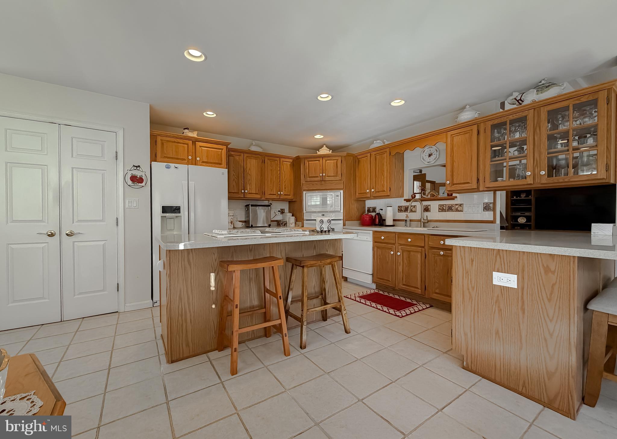 48712 Packer Court St. Inigoes, MD 20684 - Photo 14 of 55 a kitchen with stainless steel appliances a refrigerator a stove a sink and cabinets