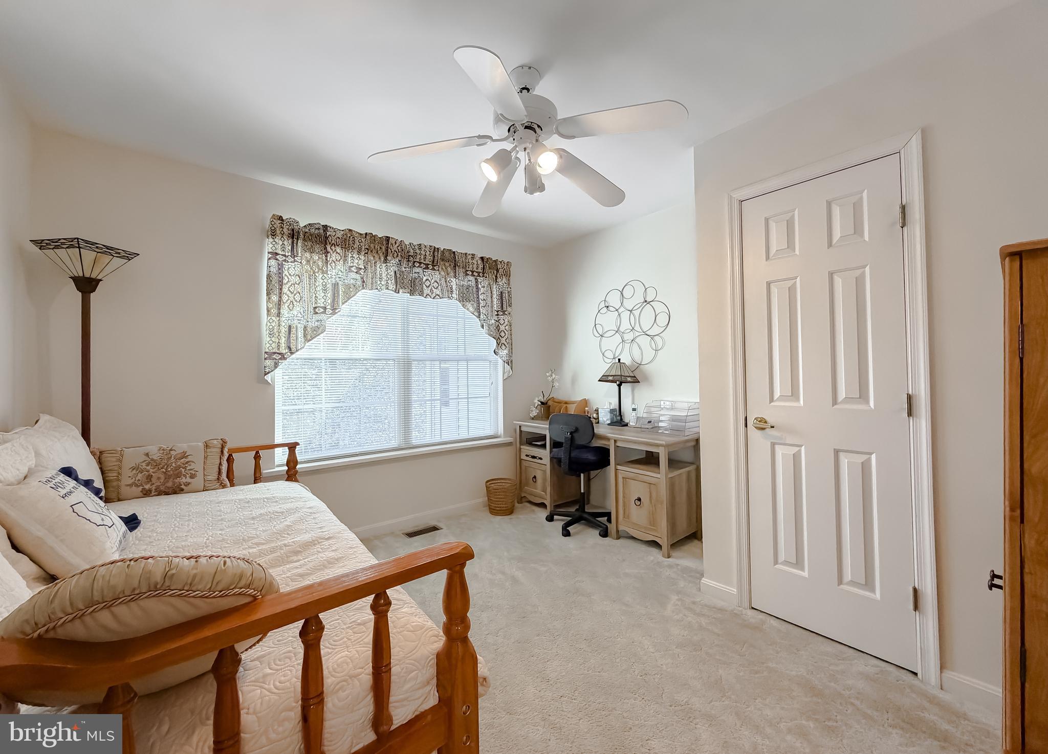 48712 Packer Court St. Inigoes, MD 20684 - Photo 22 of 55 a bed room with a bed and a chandelier