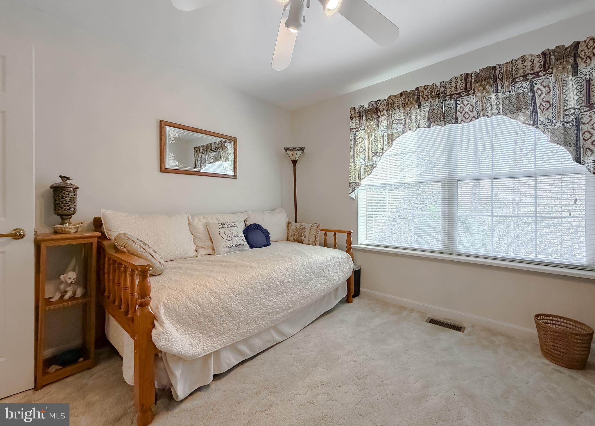 48712 Packer Court St. Inigoes, MD 20684 - Photo 23 of 55 a bedroom with a bed and a window