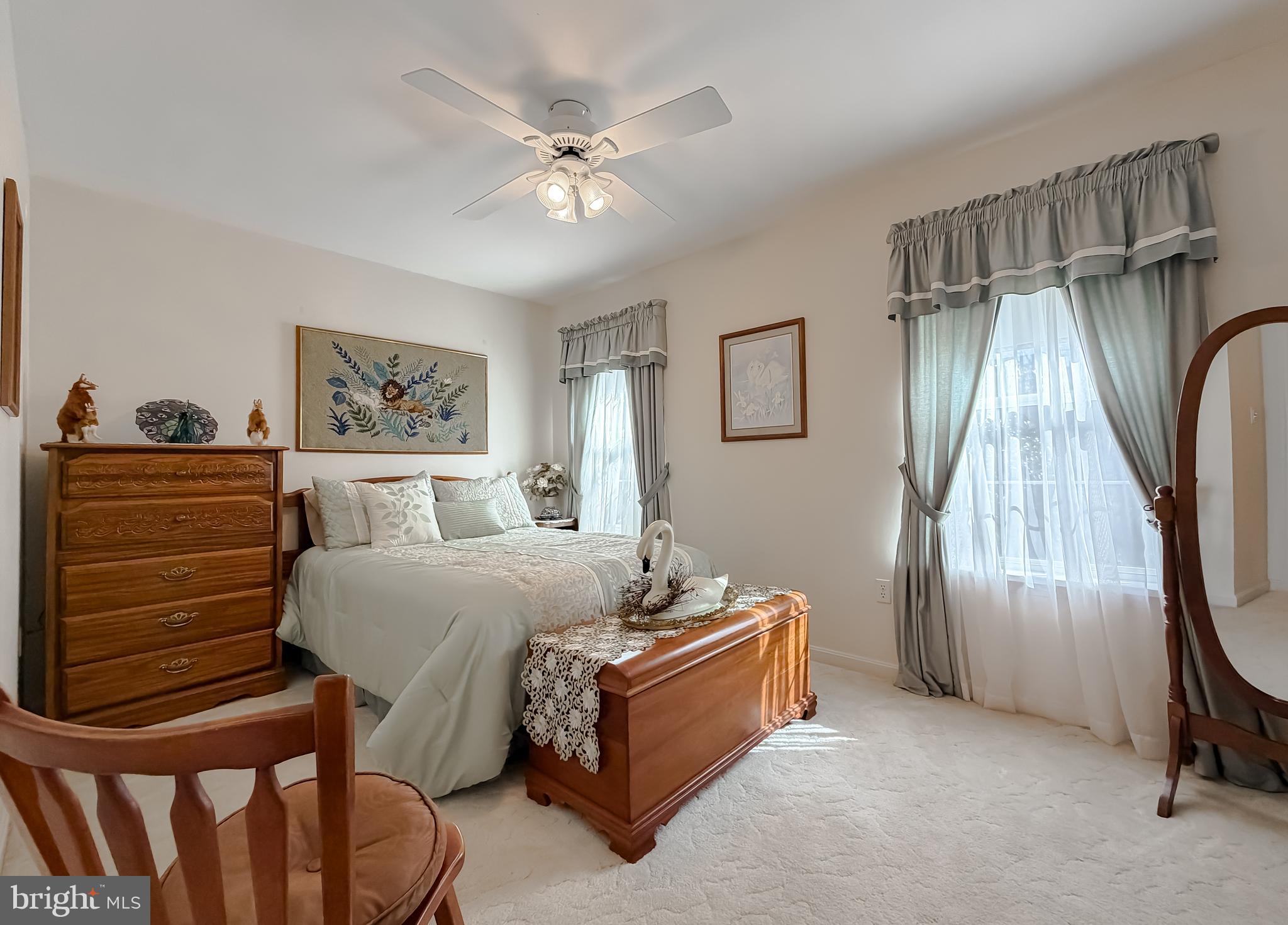 48712 Packer Court St. Inigoes, MD 20684 - Photo 24 of 55 a bedroom with a bed and a chandelier
