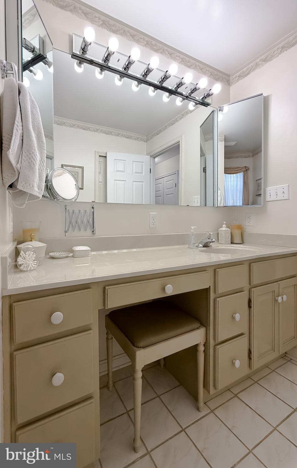 48712 Packer Court St. Inigoes, MD 20684 - Photo 27 of 55 a bathroom with a sink vanity and a mirror