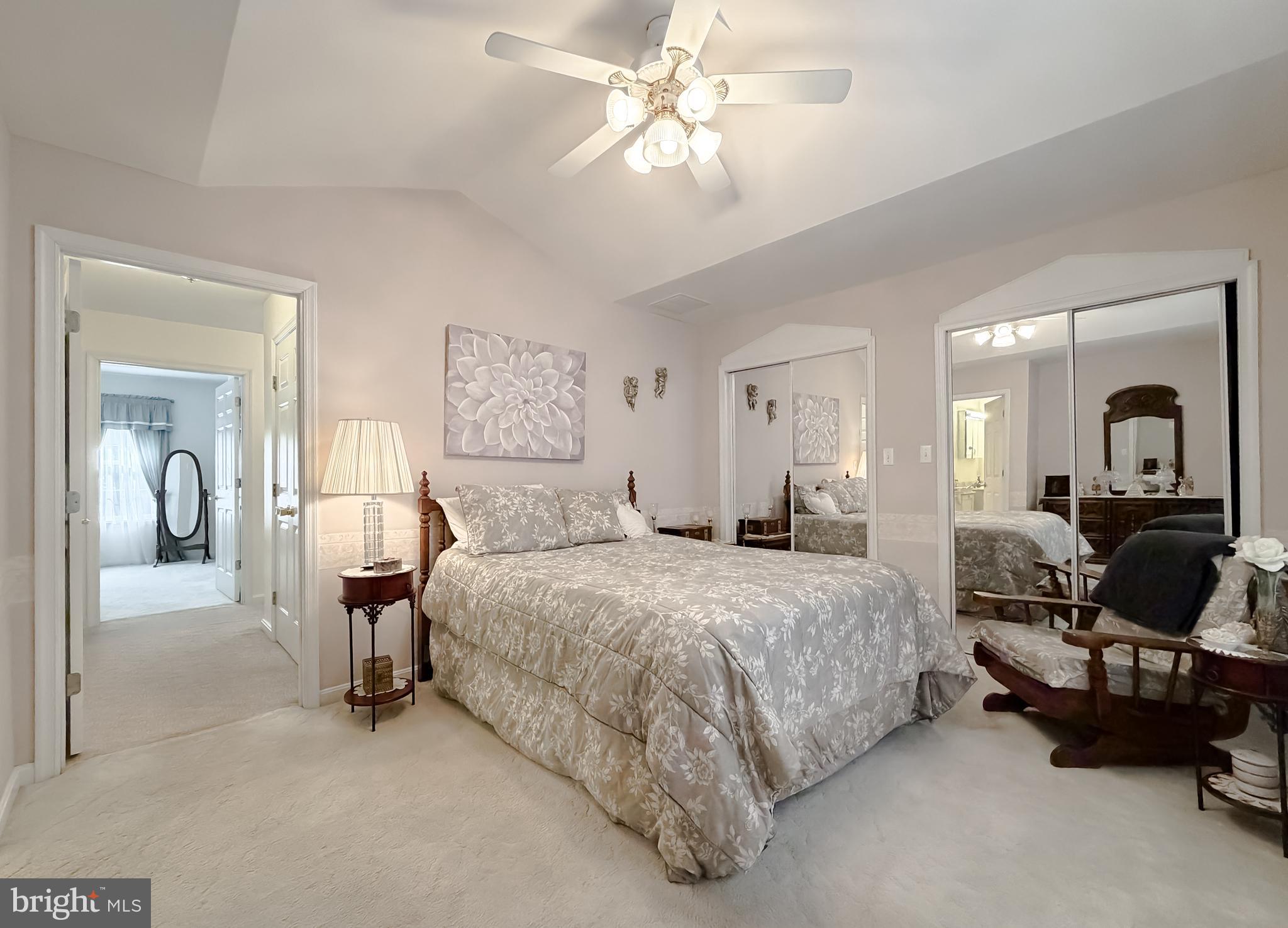 48712 Packer Court St. Inigoes, MD 20684 - Photo 32 of 55 a bedroom with a bed and ceiling fan
