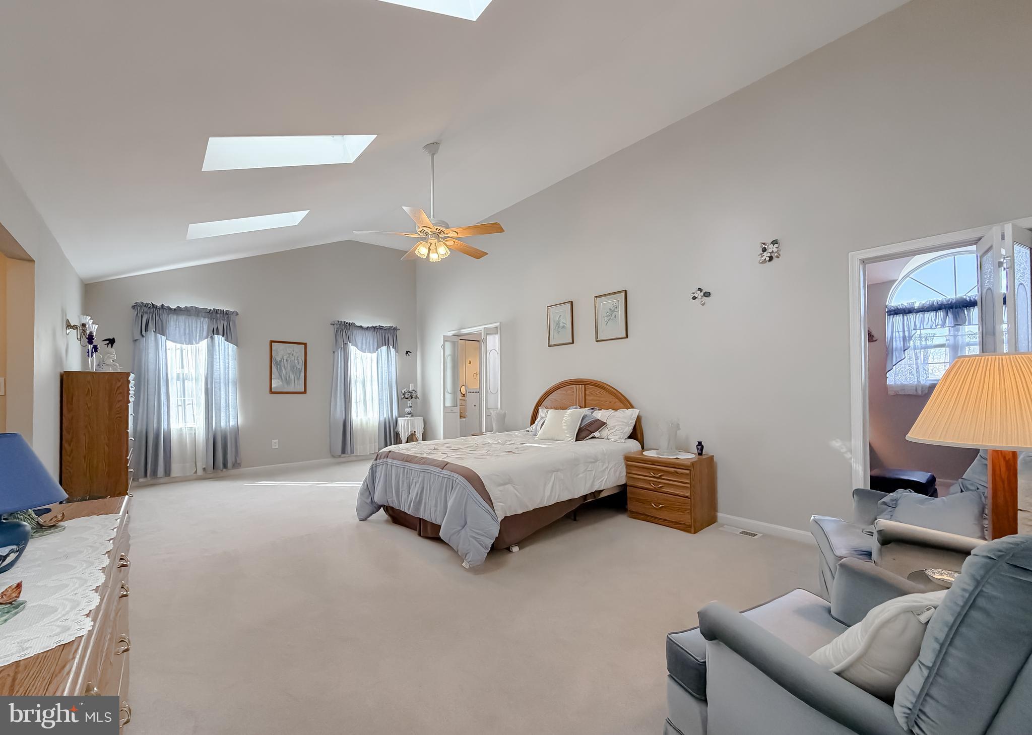 48712 Packer Court St. Inigoes, MD 20684 - Photo 34 of 55 a bed room with furniture and a flat screen tv
