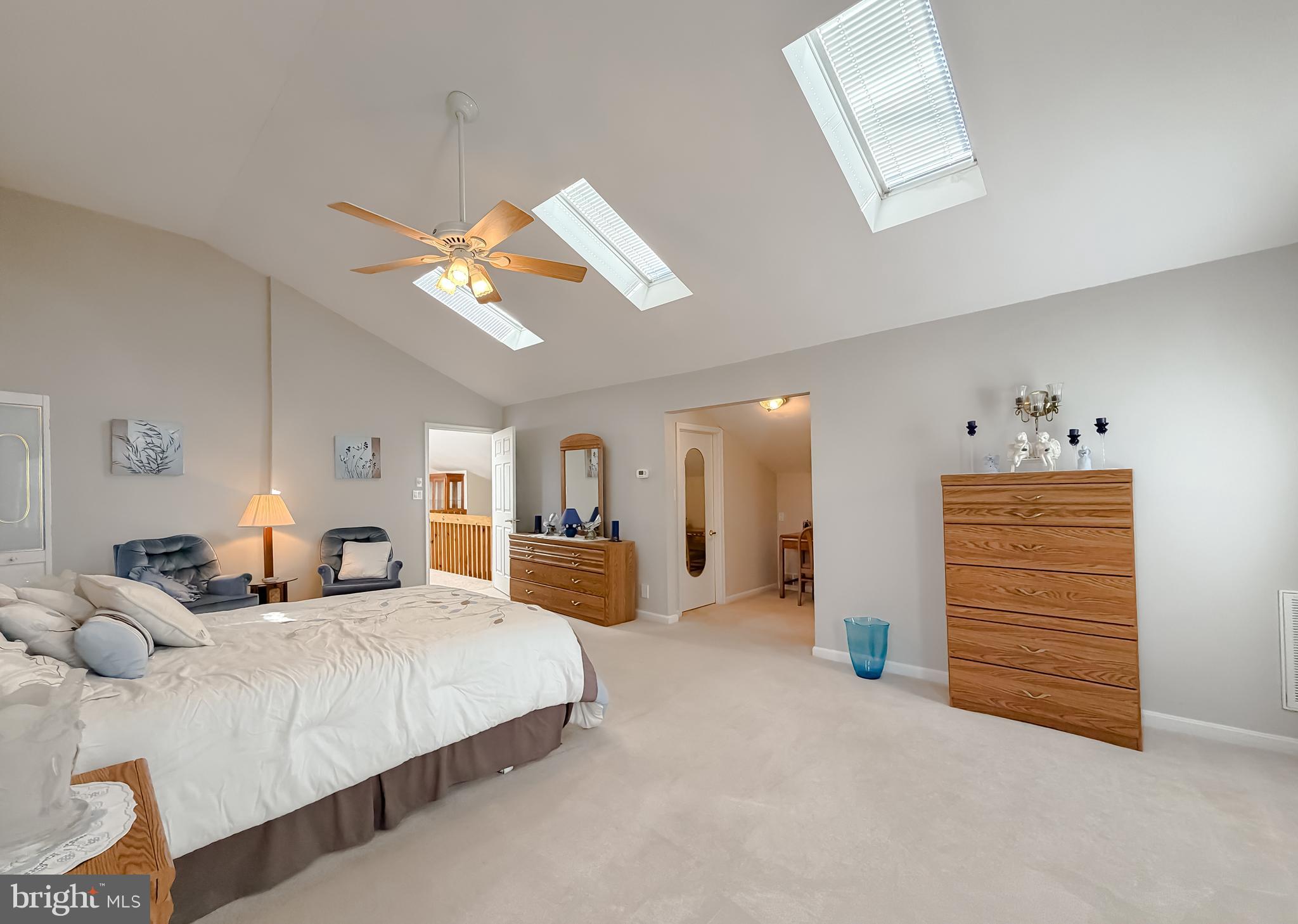 48712 Packer Court St. Inigoes, MD 20684 - Photo 37 of 55 a spacious bedroom with a bed and ceiling fan
