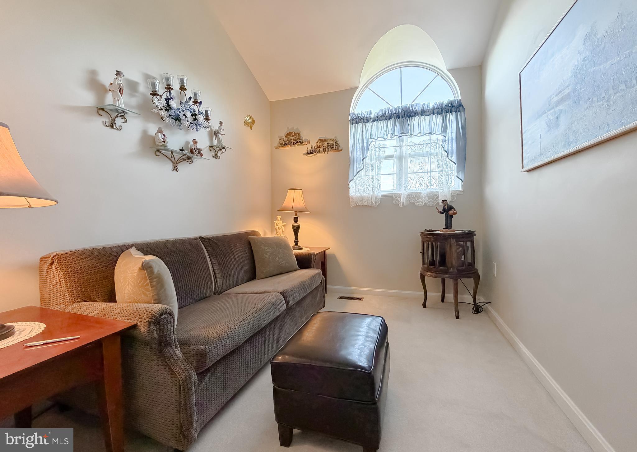 48712 Packer Court St. Inigoes, MD 20684 - Photo 38 of 55 a living room with furniture a table and a window