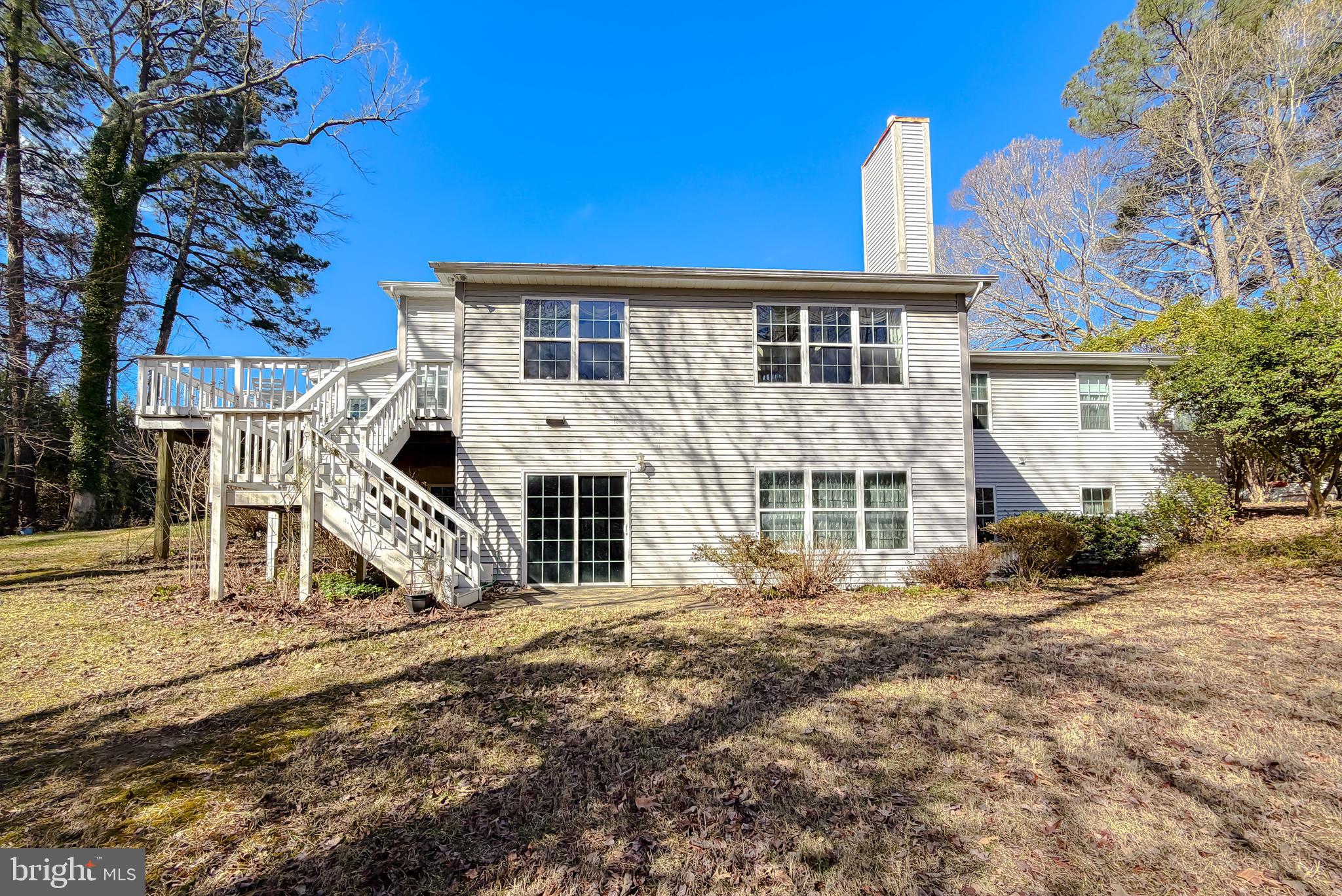 48712 Packer Court St. Inigoes, MD 20684 - Photo 48 of 55 a front view of a house with a yard