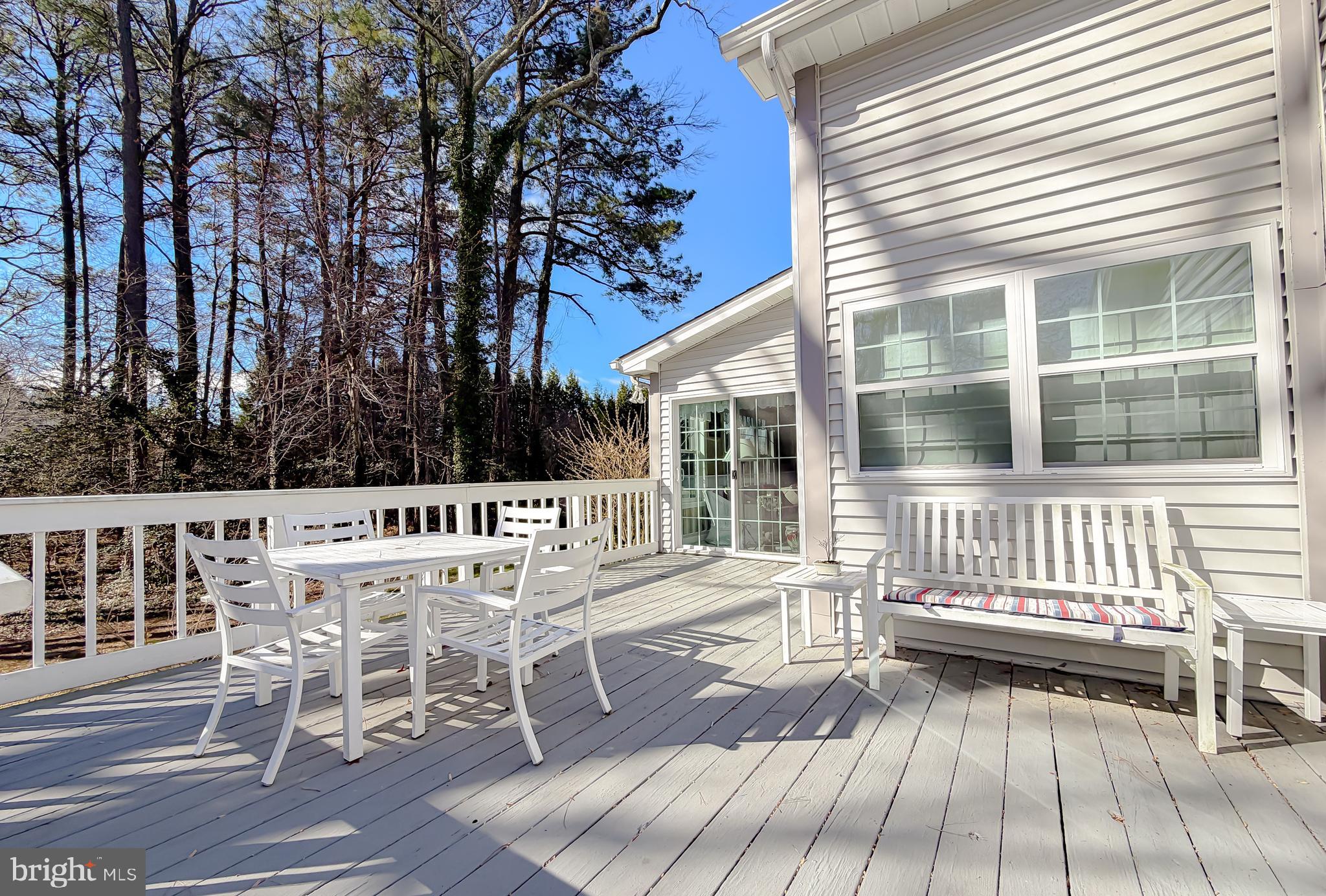 48712 Packer Court St. Inigoes, MD 20684 - Photo 49 of 55 a view of a chair and tables on the deck