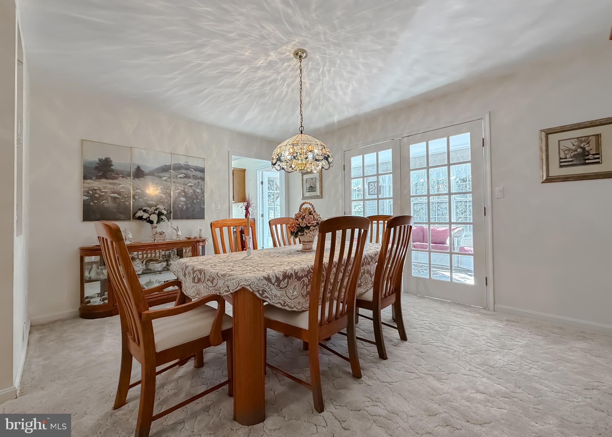 48712 Packer Court St. Inigoes, MD 20684 - Photo 6 of 55 a dining room with furniture window and chandelier