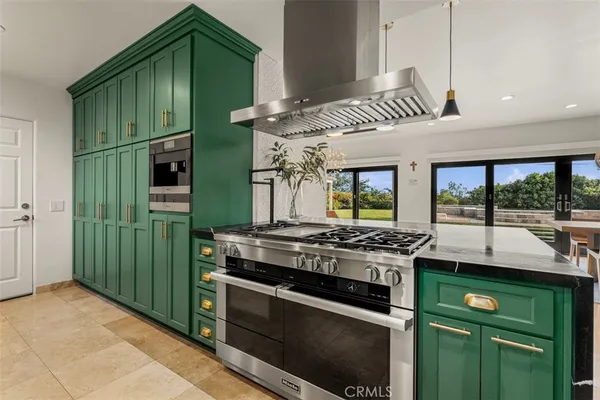 a dinning table and chairs in a kitchen